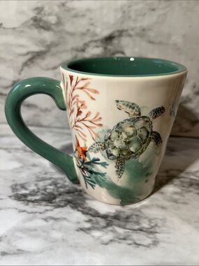 Nautical mug surrounded with a sea horse, sea turtle, school of fish and more!